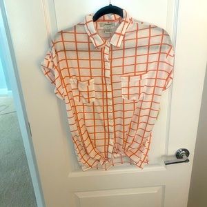Short, sleeved button up top, white with orange stripes. Size medium.